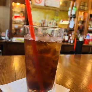 a cold drink on a napkin