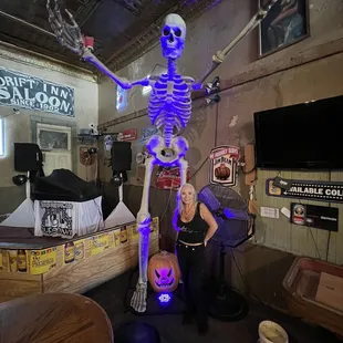 a skeleton and a woman