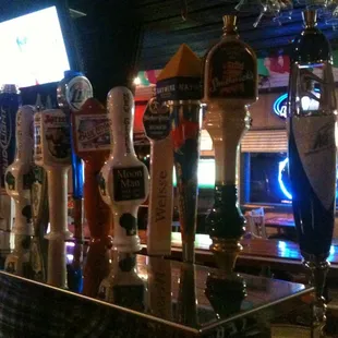 a row of beer taps