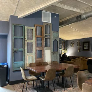 a room with a table and chairs