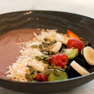 a bowl of fruit and nuts