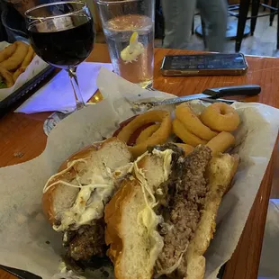 a sandwich and onion rings