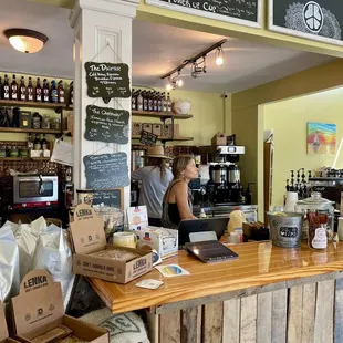 Inside of shop at ordering counter - local owner (and her son awww!) personally tends to customers! Clean, inviting, beachy shop.