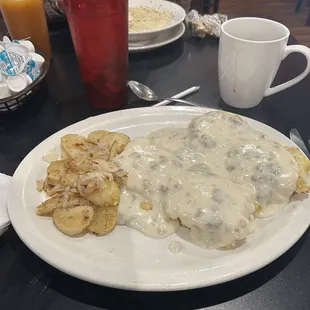 Biscuits and gravy with onions &amp; homefries.