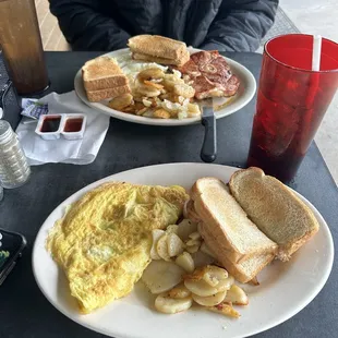 Three cheese omelet with bacon, potatoes no onions, white toast.