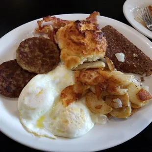 Driftwood Breakfast eggs,sausage,home fries, side of Scrapple and grilled biscuit and pancakes. Yummy