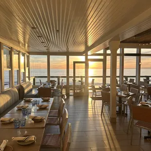 Main dining looking out to balcony seating. Ocean view