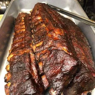 a rack of ribs on a tray