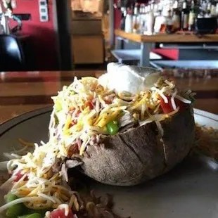 a loaded baked potato on a plate