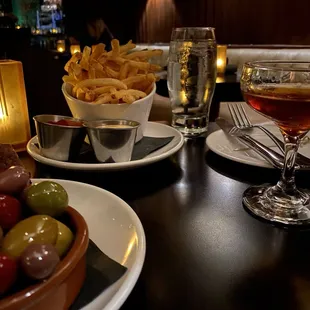 Olives, shoestring potatoes and Smoking gun