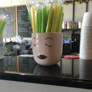 A cute cup with their straws.