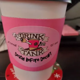 a cup of coffee on a coaster