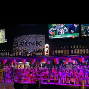 a bar filled with liquor bottles