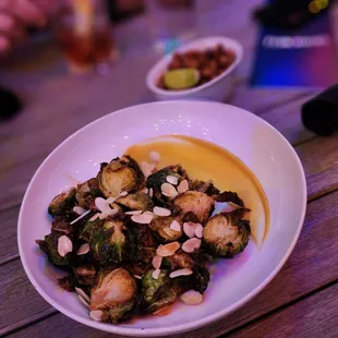 a bowl of food on a wooden table