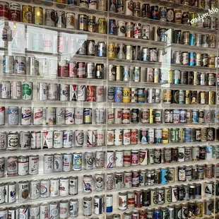 a wall of beer cans