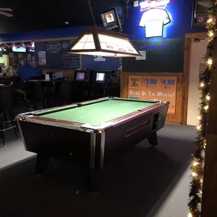 a pool table in a bar