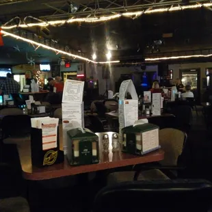 tables and chairs with menus on them