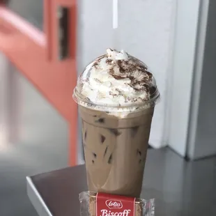 a cup of iced coffee on a table