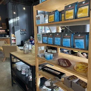 shelves of coffee and other items in a coffee shop