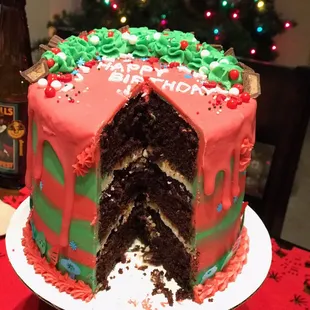 Chocolate cake with peanut butter chocolate filling and white peanut butter ganache frosting!