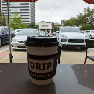 a coffee cup sitting on a table