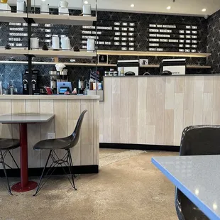 a coffee shop with a counter and chairs
