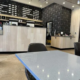 the counter and seating area of a coffee shop