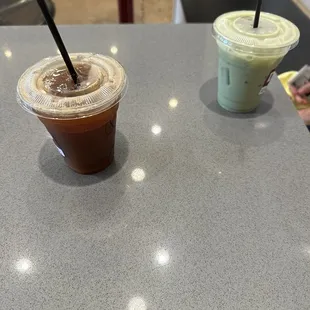 Iced decaf americano and iced matcha with oat and strawberry syrup