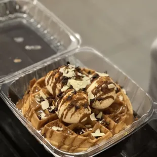 a waffle with ice cream and chocolate