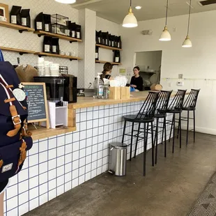 a woman standing in front of the counter