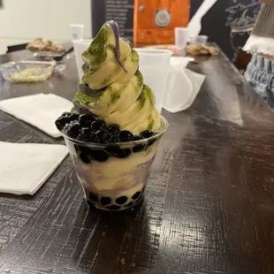 Vanilla ube swirl with boba and matcha dust