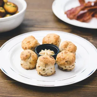 a plate of biscuits and bacon
