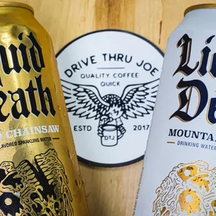 two cans of beer on a table