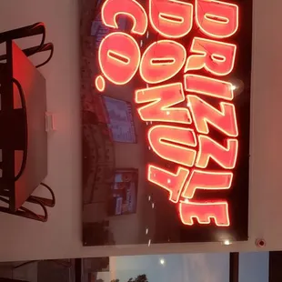 Drizzle Donut co. neon sign.