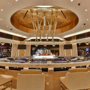 a circular bar with a fountain in the center