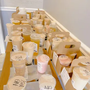 a long table with cups of tea