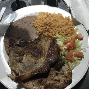 Pork chops, rice and beans with 5 tortillas. A lunch special, pretty good and good amount of food. I'd order again.