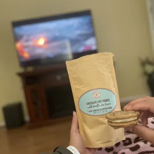 a person holding a bag of cookies