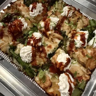 FRIES ON A PIZZA?
 (v) waffle fries, broccolini, roasted garlic, cheddar, ricotta, scallions, bbq