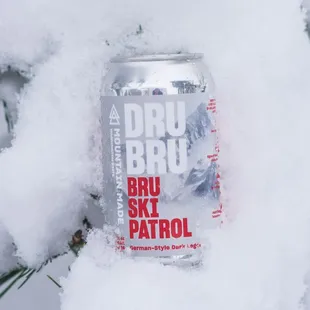 a can of beer in the snow