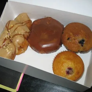 Peanut butter twister, chocolate glazed donut, blueberry and muffins