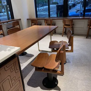 a table and chairs in a coffee shop