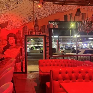 a bar with red lighting