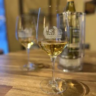 a glass of wine and a bottle of wine