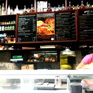 a woman behind the counter