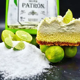 a slice of lime pie and limes