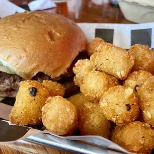 Hamburger with fried onions. Tater Tots with Cajun seasoning.