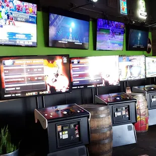 a row of televisions in a sports bar