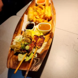 Combination Appetizer ($15.95 - 3 Veggie spring rolls, 2 shrimp blanket, 3 crab rangoon, 2 satay, 3 gyoza, 3 dumplings)