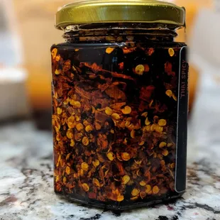 Homemade Thai garlic chili oil. $10.